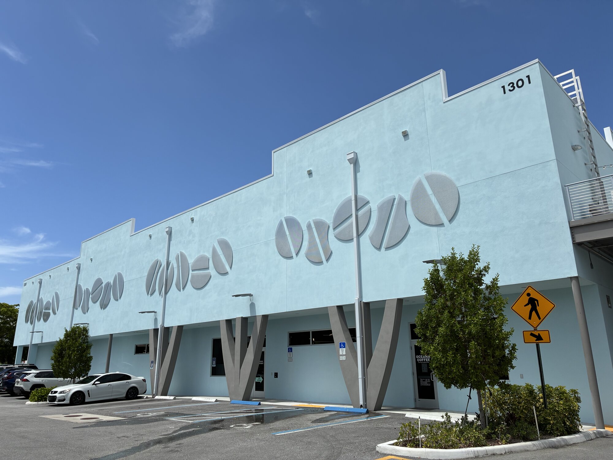 Oceana Coffee's Lake Park building, with oversized coffee bean sculptures on the facade